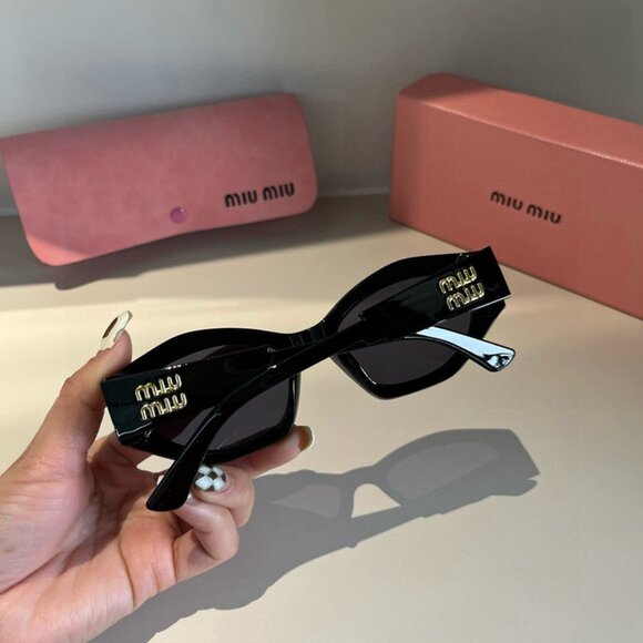 Miu Miu Black Sunglasses with Gold Detail